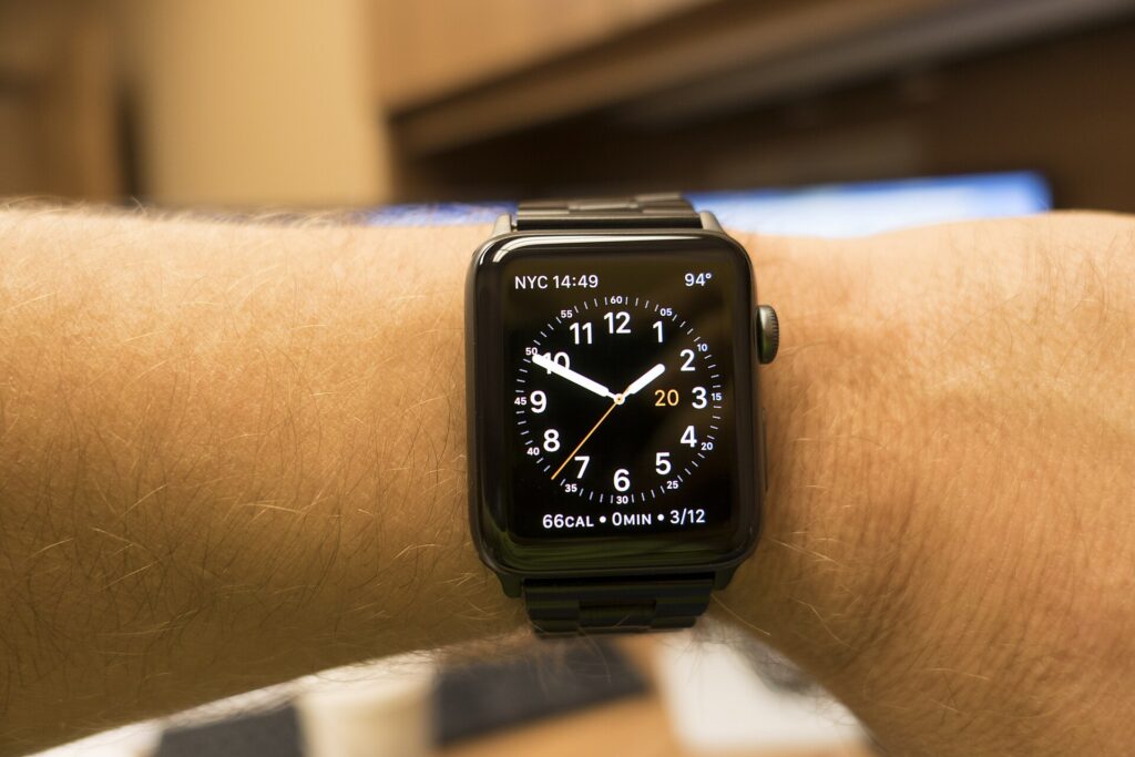 A smartwatch worn on a wrist, showing fitness tracking during everyday activity