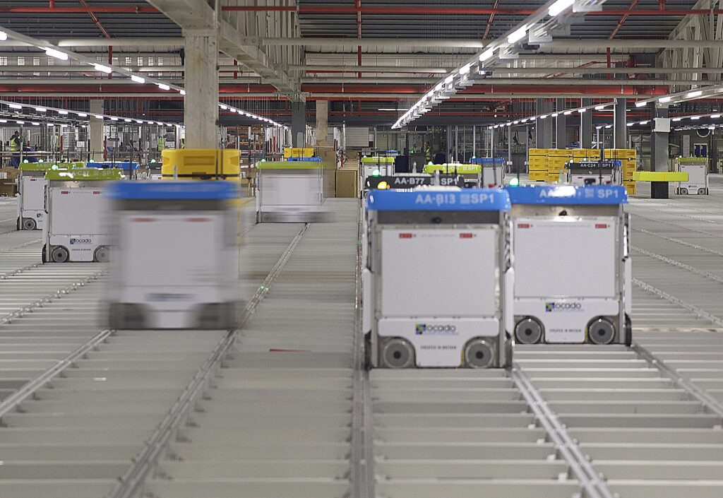Robots and shelving inside a modern automated warehouse